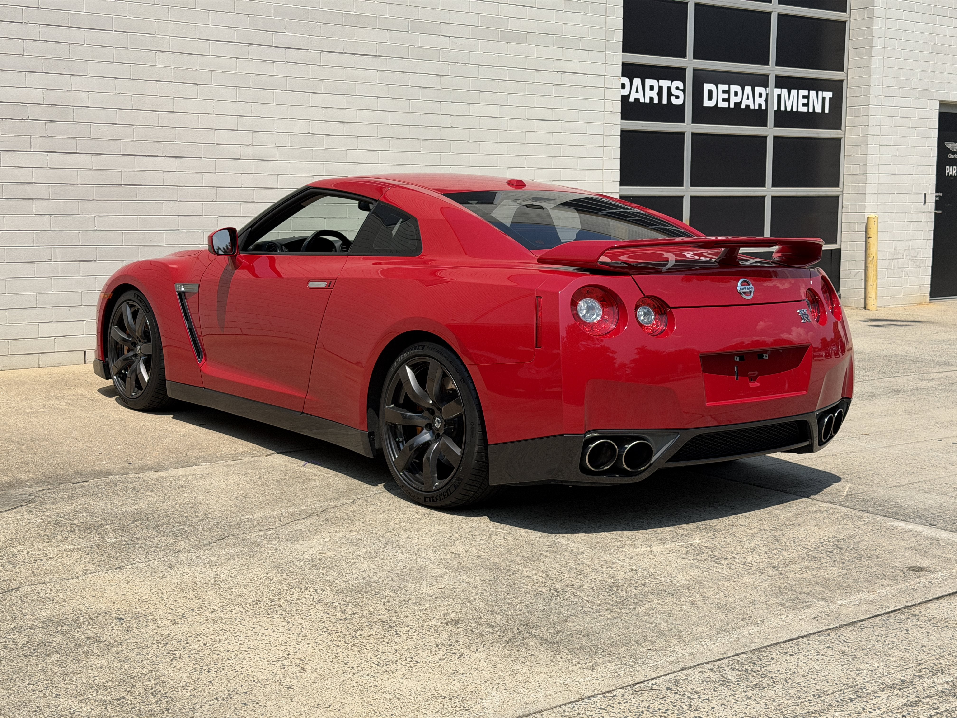 Used 2010 Solid Red Nissan Premium image 2