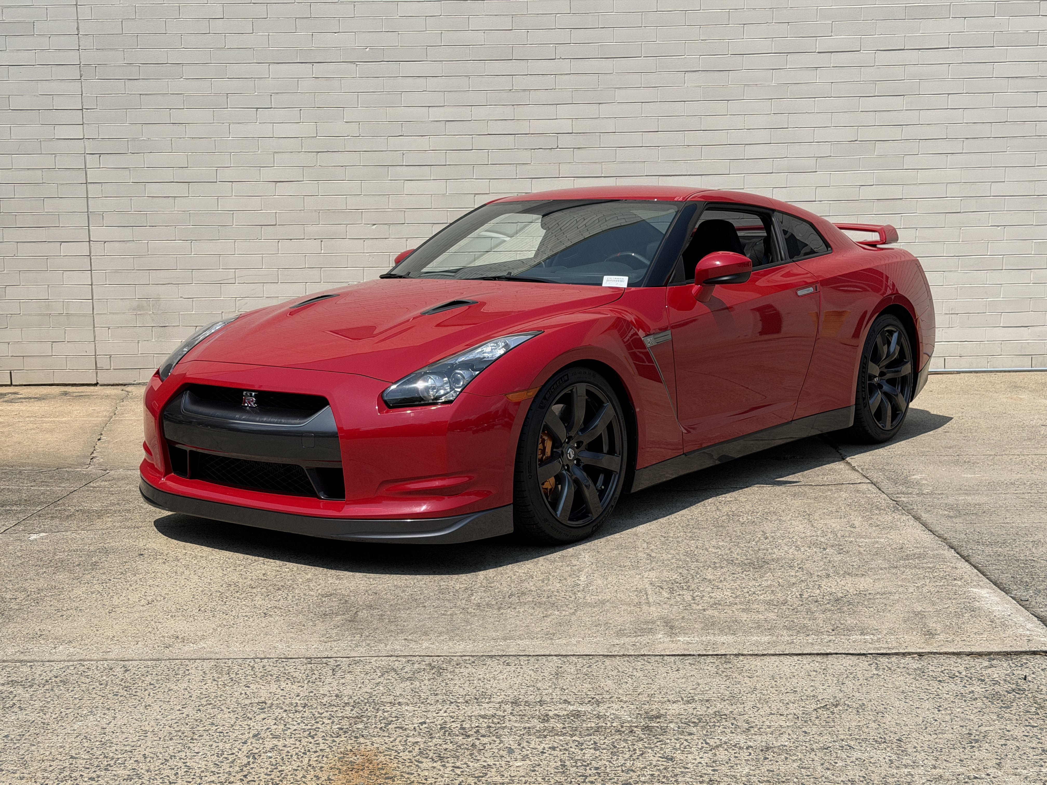 Used 2010 Solid Red Nissan Premium image 4
