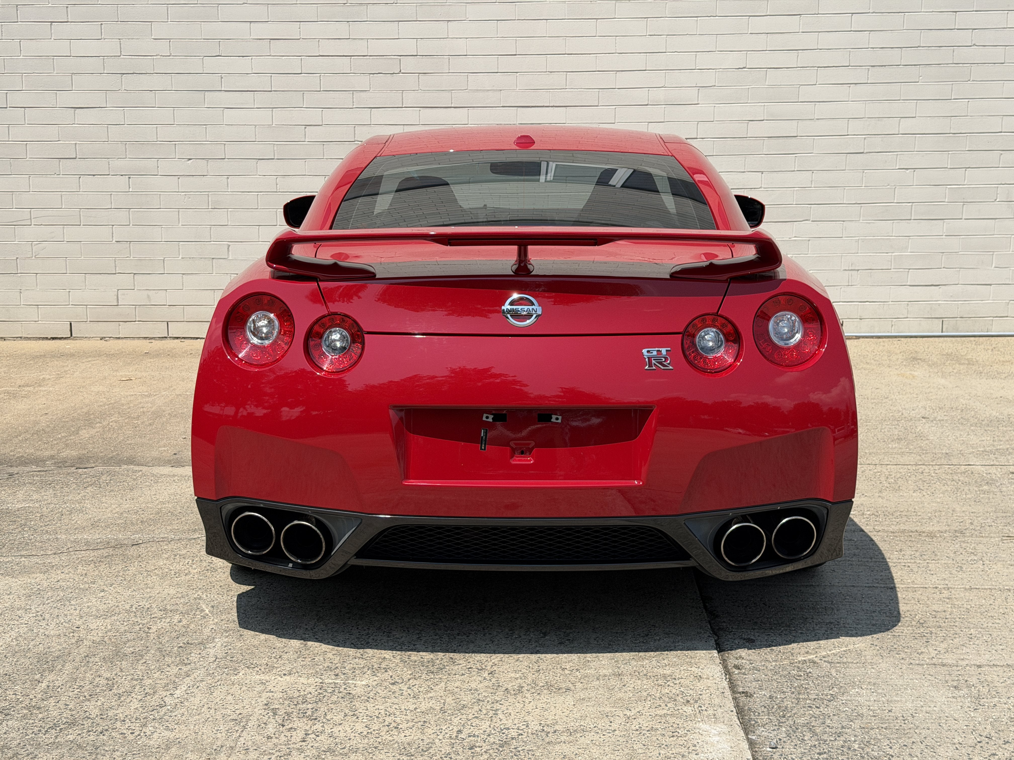 Used 2010 Solid Red Nissan Premium image 8