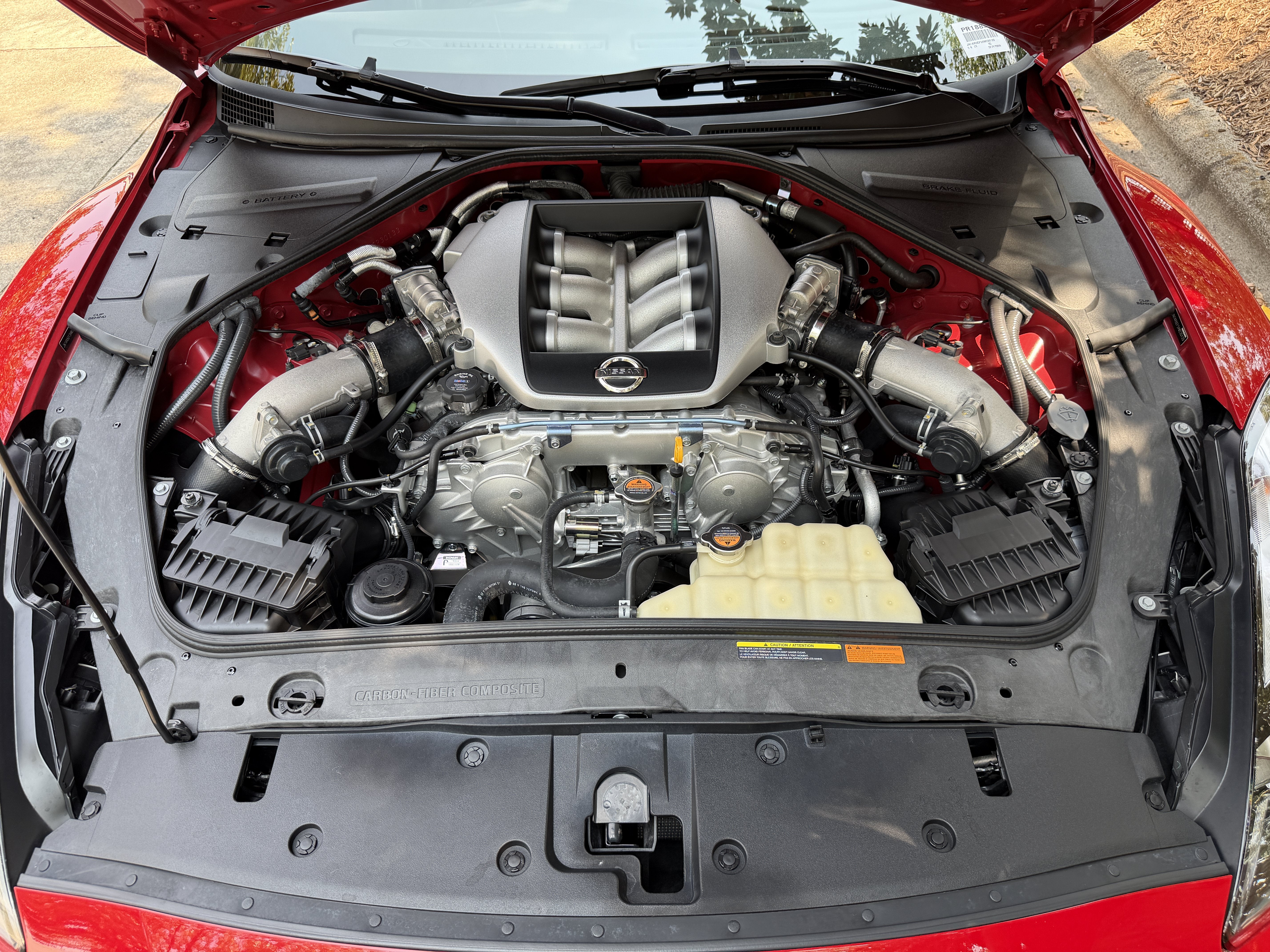 Used 2010 Solid Red Nissan Premium image 9