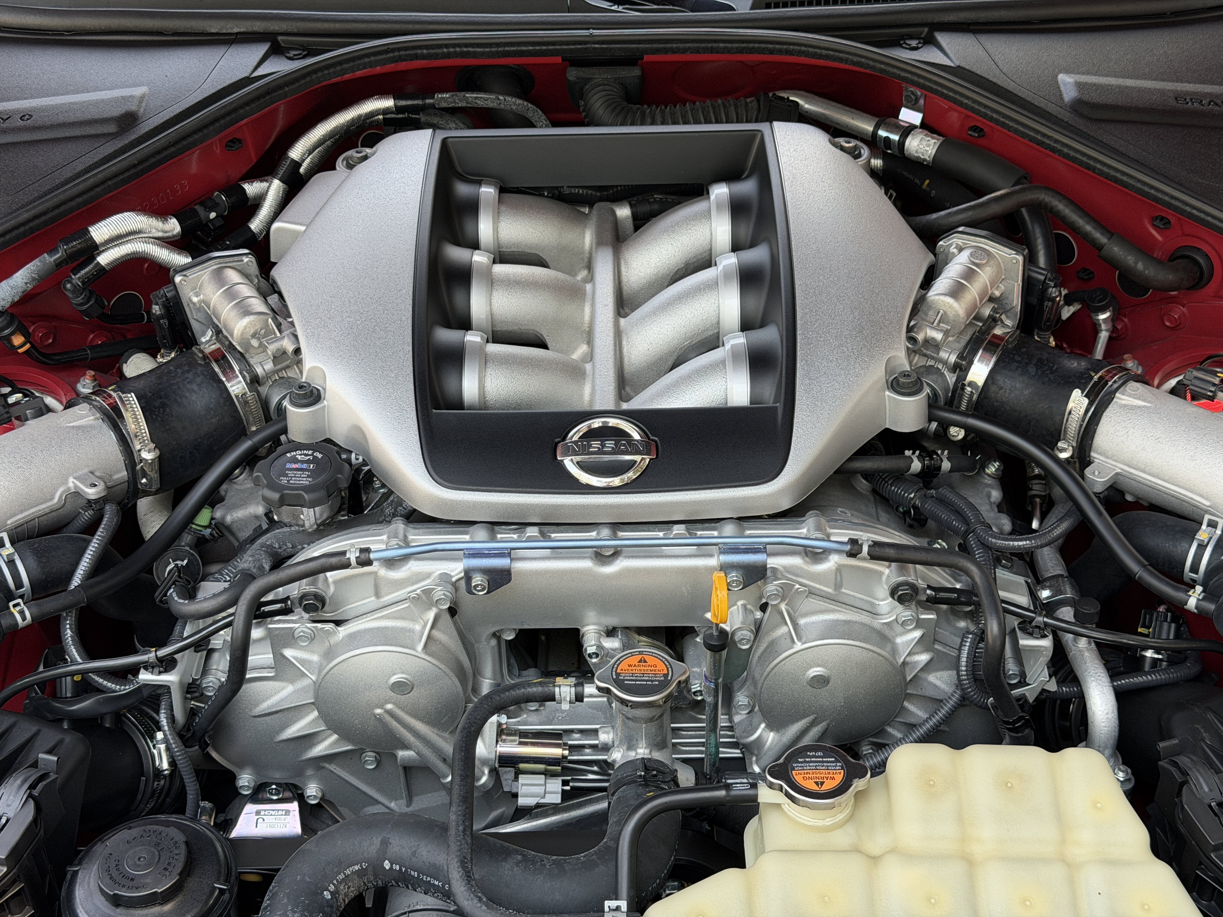 Used 2010 Solid Red Nissan Premium image 10