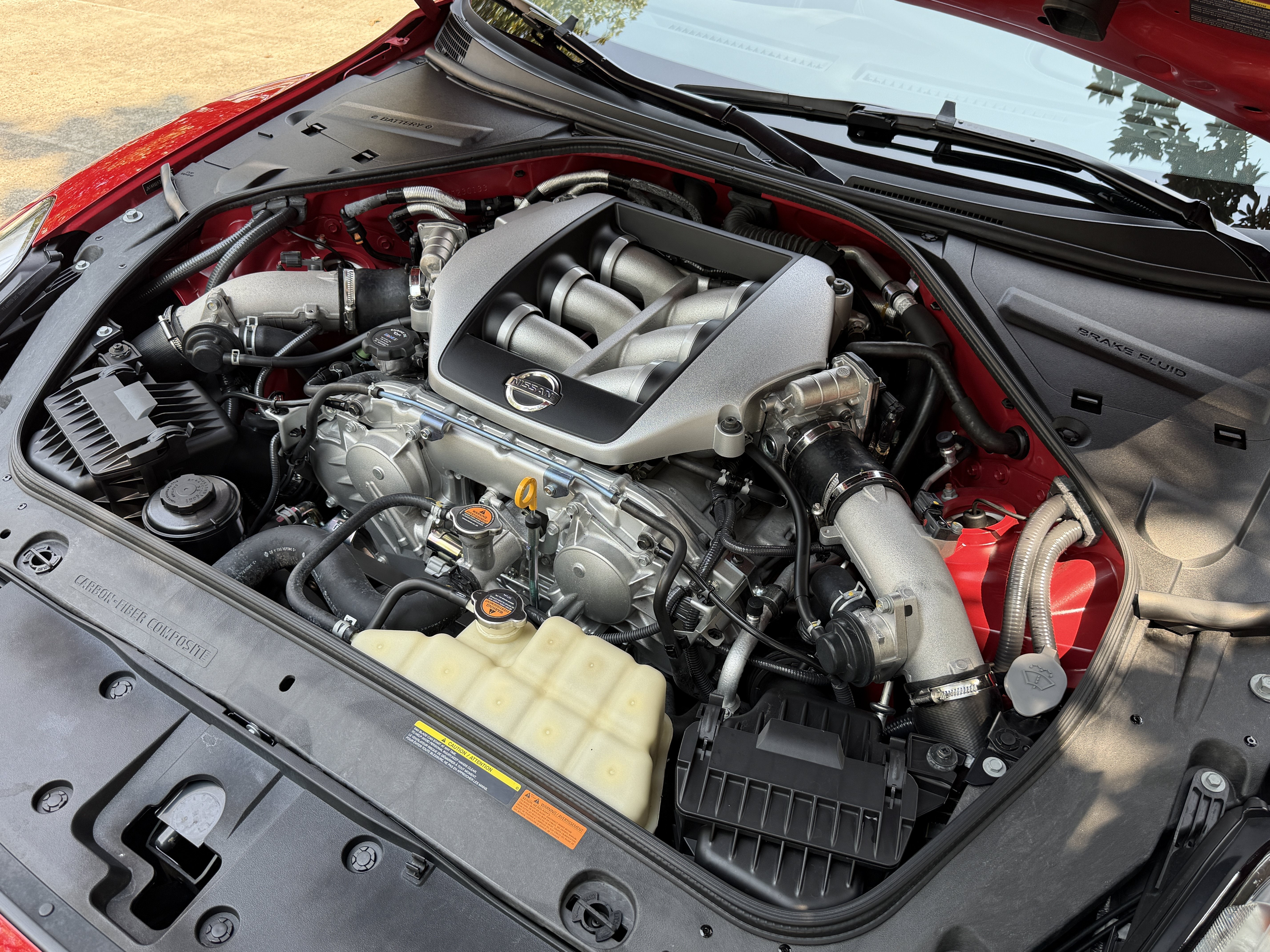 Used 2010 Solid Red Nissan Premium image 11