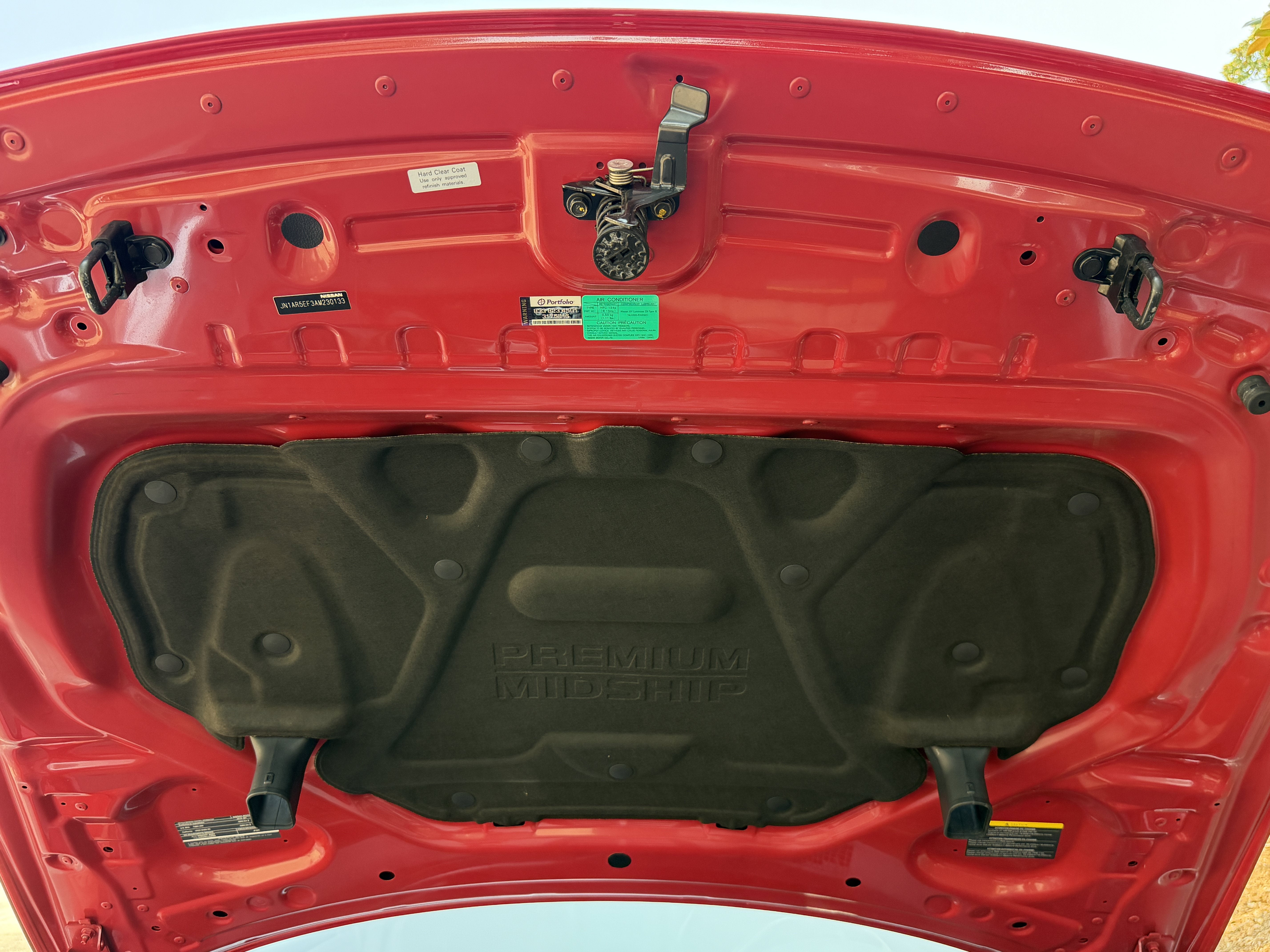 Used 2010 Solid Red Nissan Premium image 12
